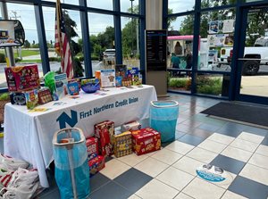 table in lobby with donated snack items on display
