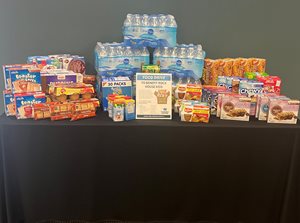 table with snack food donation items displayed