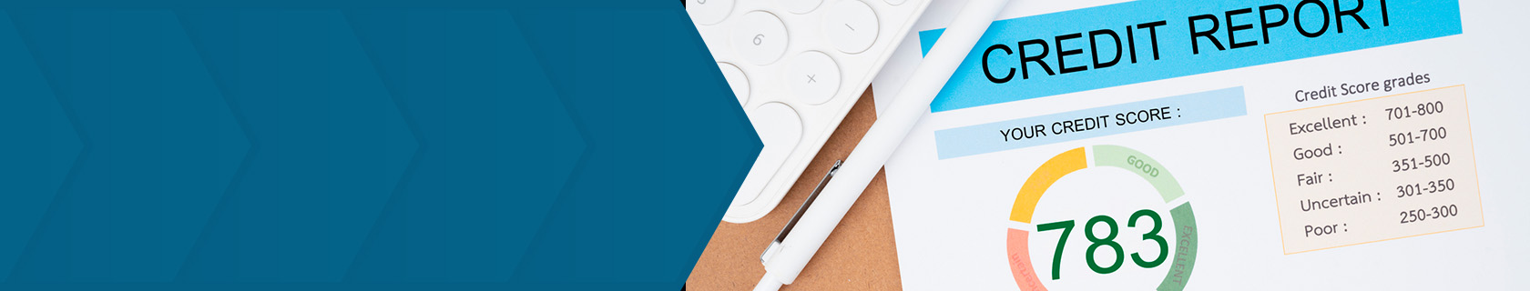 Top down view of a calculator, pen, and a printed credit report that shows a range of credit scores and what they mean.