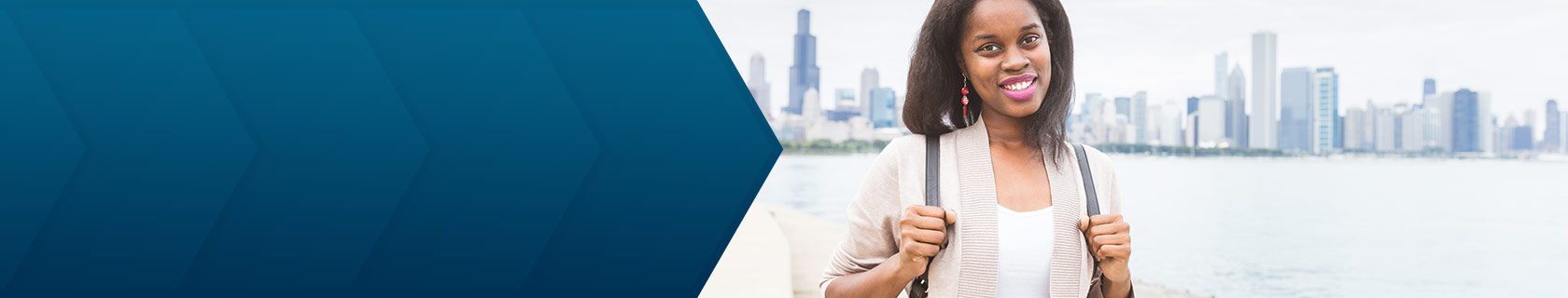smiling woman holding a backpack in front of Chicago skyline