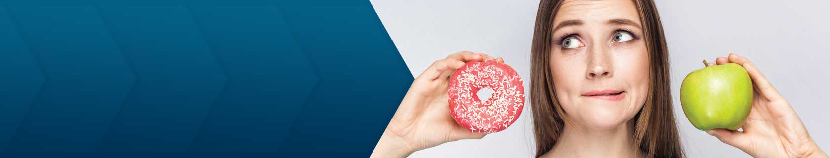 woman holding donut and apple